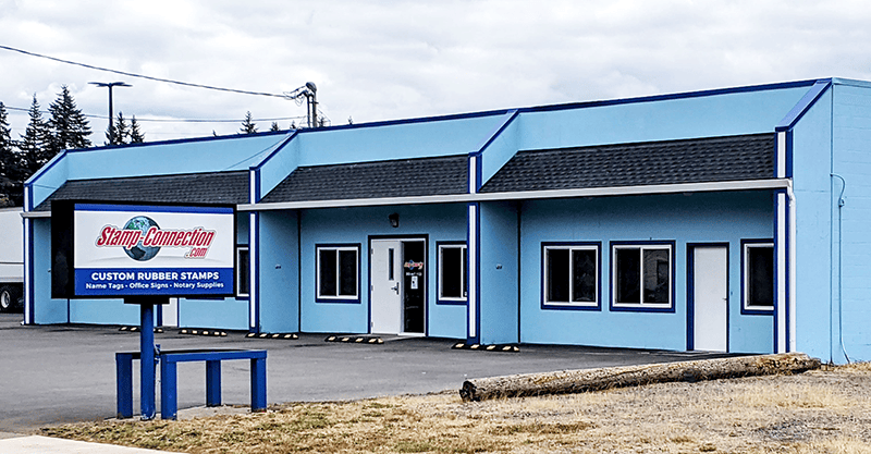 photo of the Stamp-Connection building and sign as viewed from the street